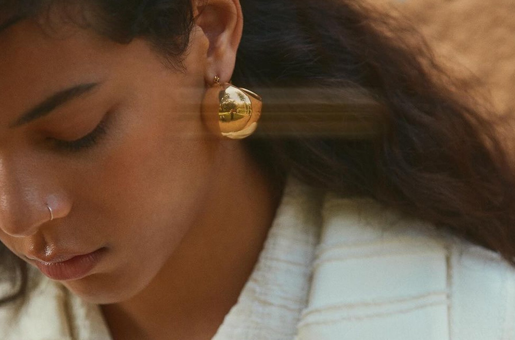 reliquia jewellery oversized gold earrings at blanca fashion week