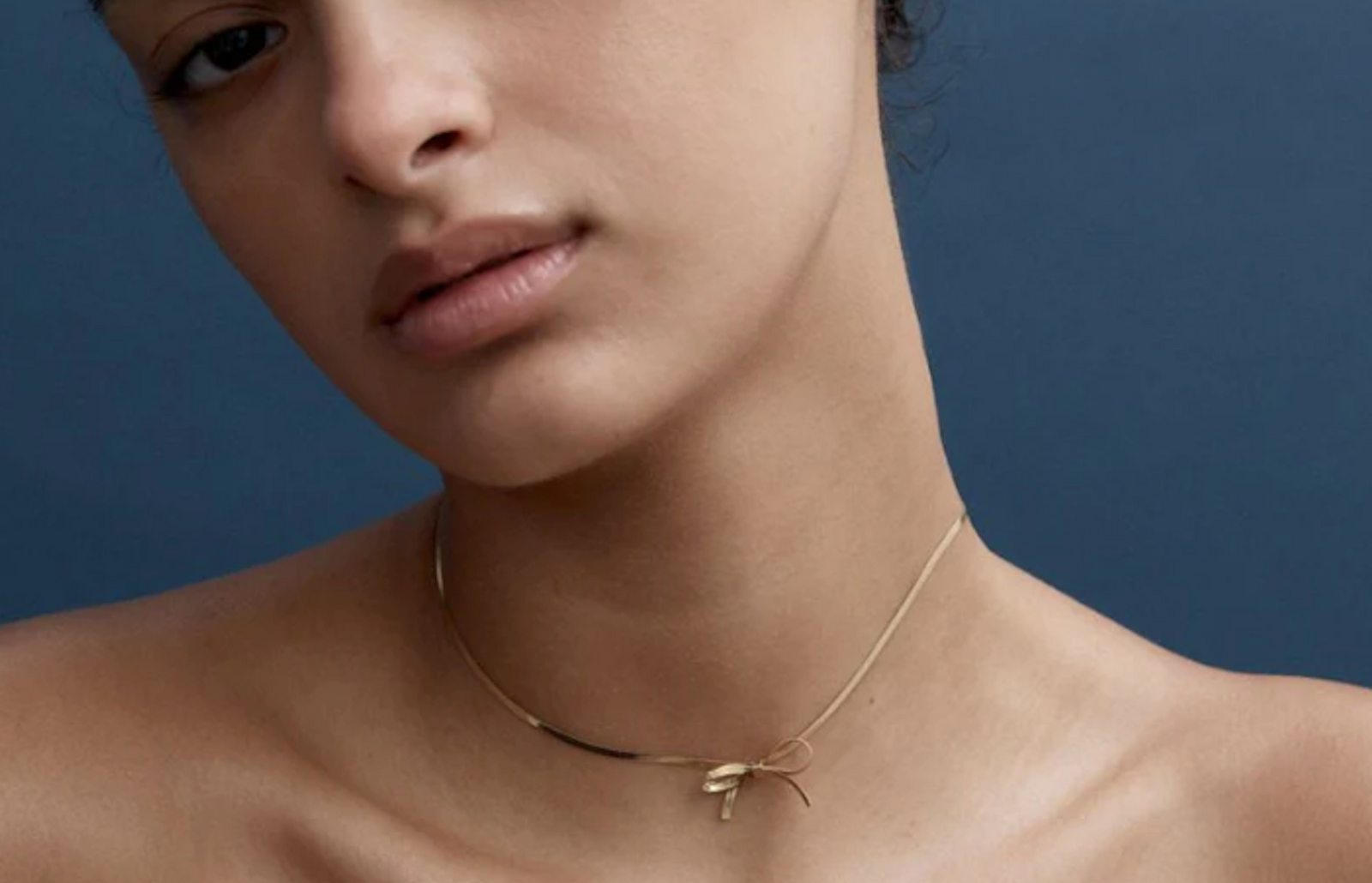 waterproof gold bow necklace by reliquia jewellery