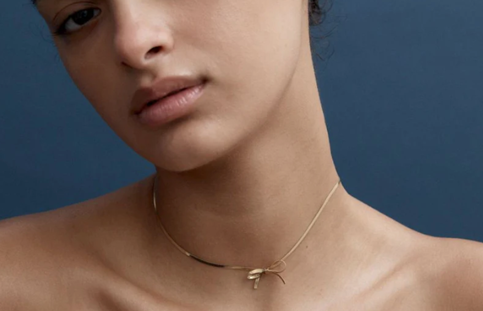 waterproof gold bow necklace by reliquia jewellery